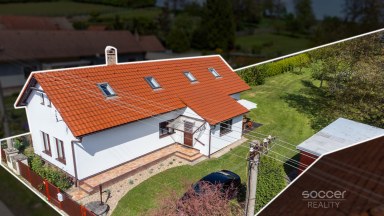 Malebný dům s příjemnou zahradou v atraktivní lokalitě.